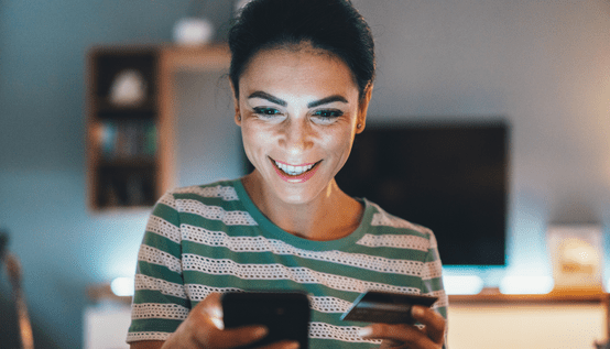 woman with phone and card